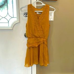 Beautiful mustard colored chiffon top by DO+BE.  NWT.  Raw edges look unique.